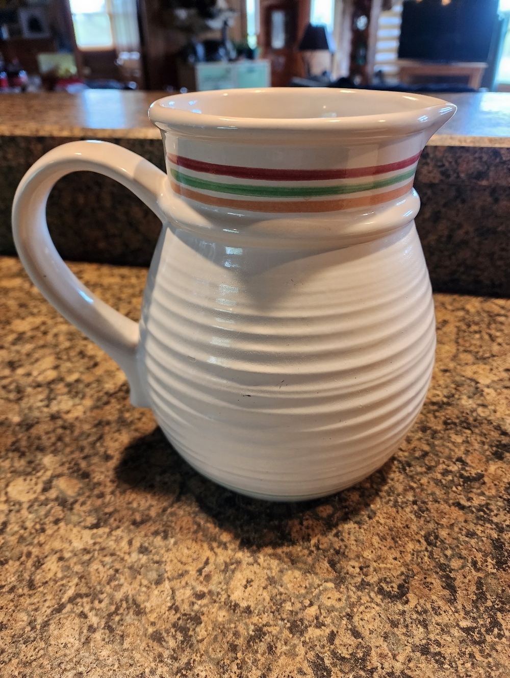 White Treasure Craft Ceramic Pitcher with Red, Green and Orange Stripe